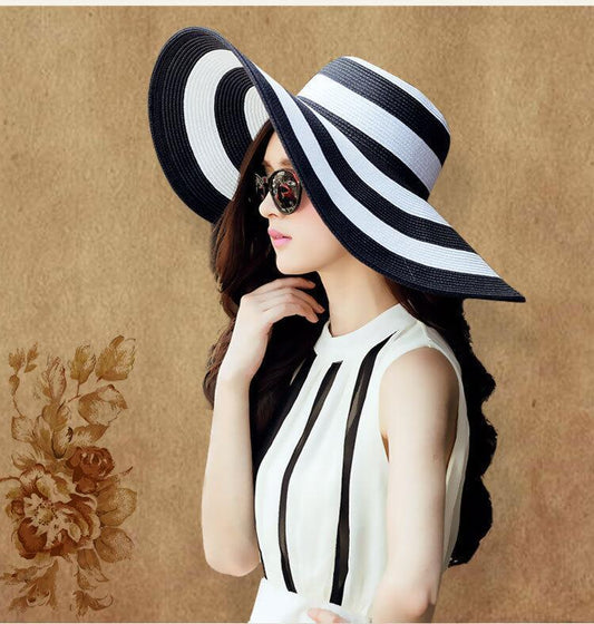 Black and white striped straw hat along the beach