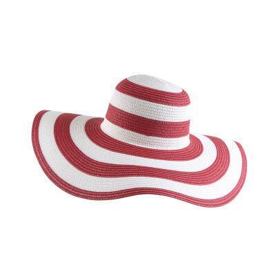 Black and white striped straw hat along the beach